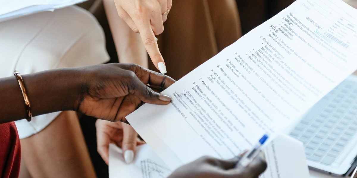 Individuals carefully reviewing terms and conditions of a commercial lease agreement, emphasizing clarity.