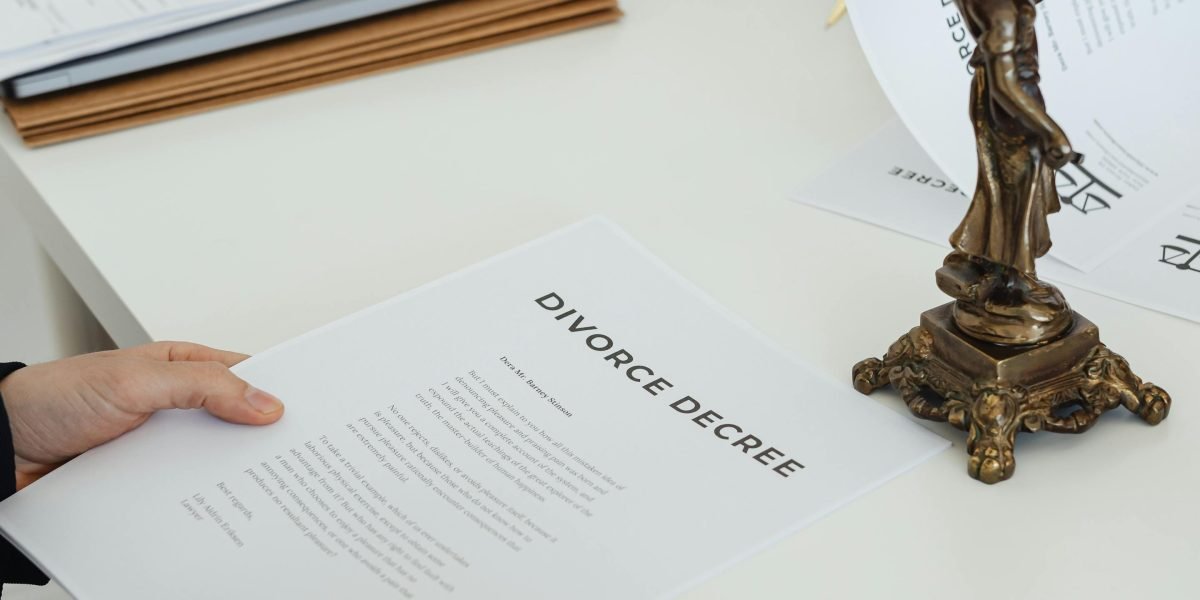 Business partners carefully review legal documents to ensure due diligence for property acquisition.