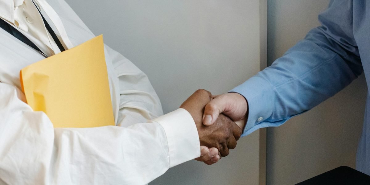 Professionals concluding a successful negotiation for commercial lease terms.