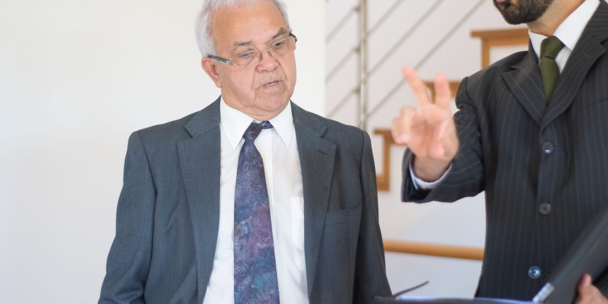 Stock photo suggestion: client and advisor in a consultative meeting to illustrate agent vetting and trust-building.