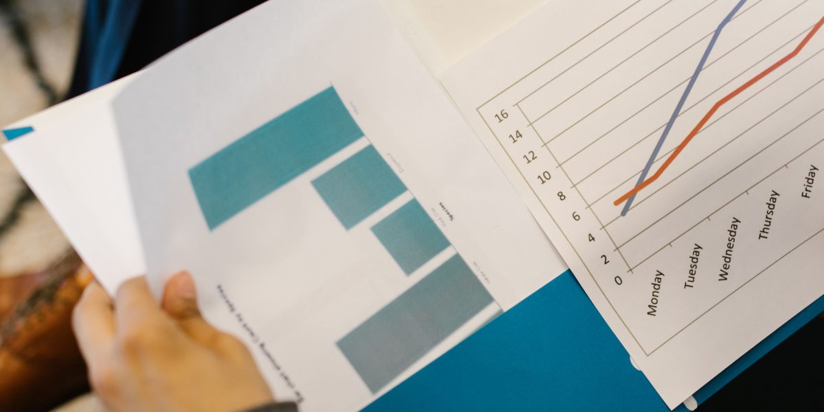 A team of professionals thoroughly reviewing legal and financial documents for a property deal.