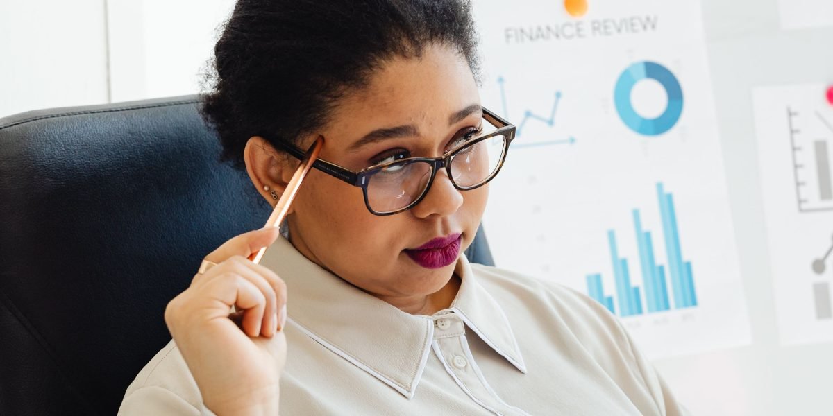 A person thoughtfully considering various options, symbolizing the careful decision-making involved in complex investment choices.