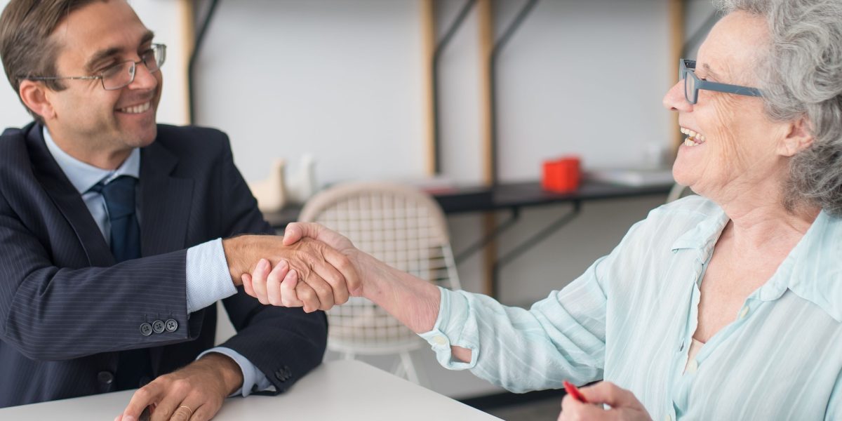 A client receiving expert guidance from a trusted advisor in a professional setting.
