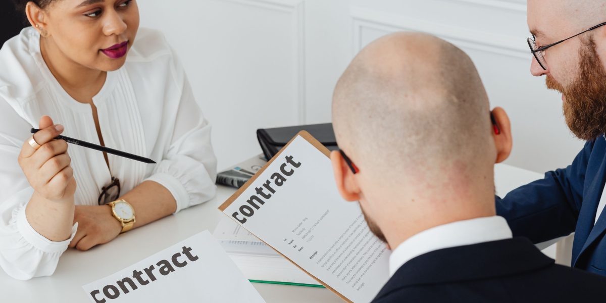 Professionals collaborate to review legal documents, ensuring clarity and compliance in property transactions.