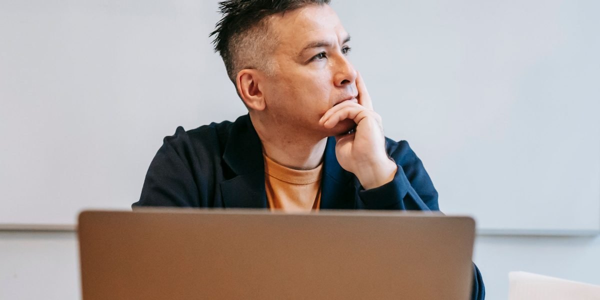An investor contemplates the complexities of finding commercial property, symbolizing the challenges of scattered information.