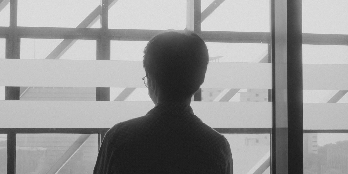A person deep in thought, considering future investment prospects in a dynamic market.