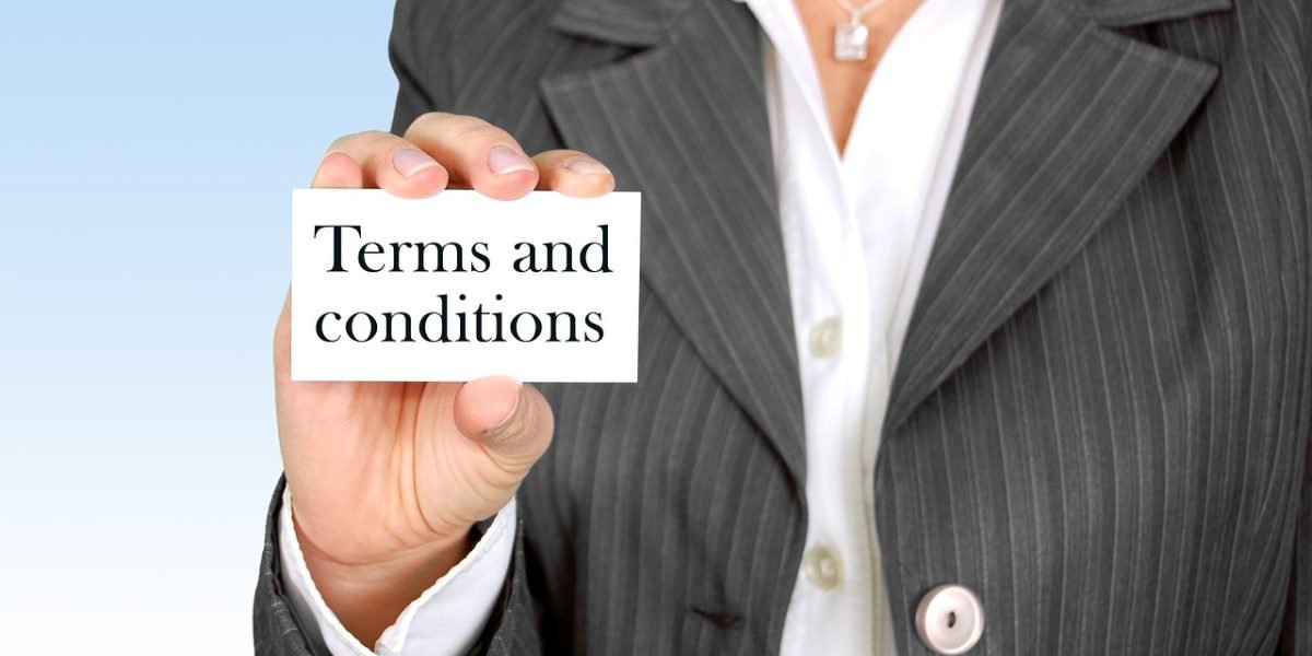 Business partners carefully reviewing legal documents, emphasizing the importance of diligence in real estate transactions.