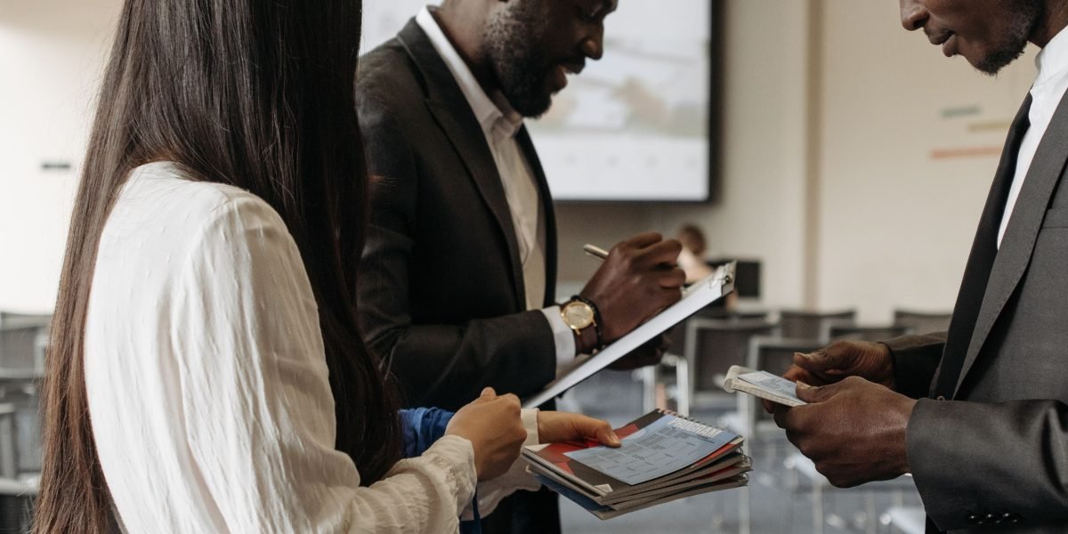 Professionals networking at an industry event, building connections for commercial real estate opportunities.
