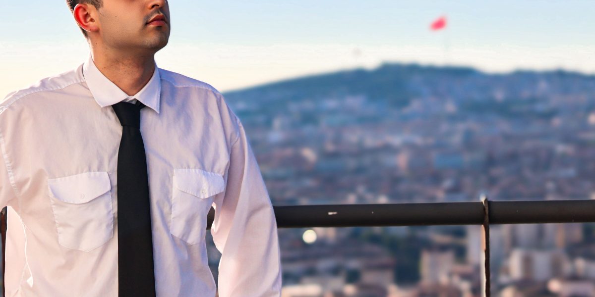 A confident investor surveys the Dubai skyline, symbolizing promising real estate opportunities.