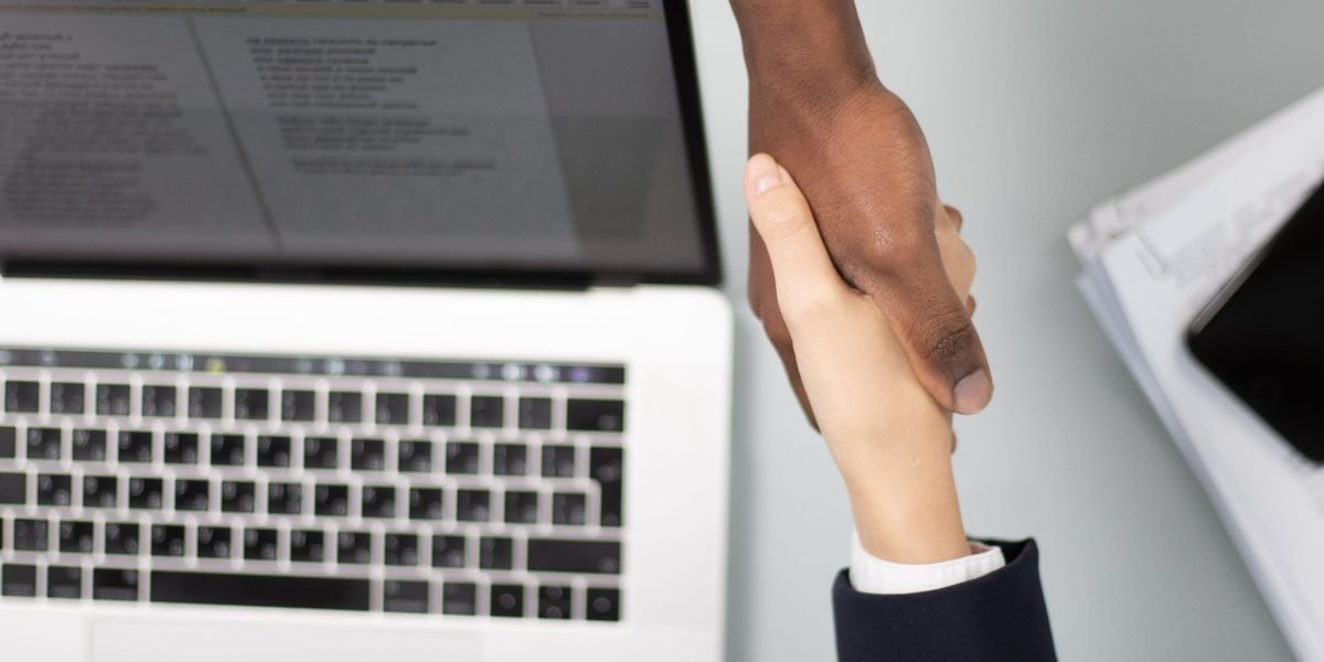 A handshake symbolizes a successful negotiation and the start of a trusted partnership in real estate.