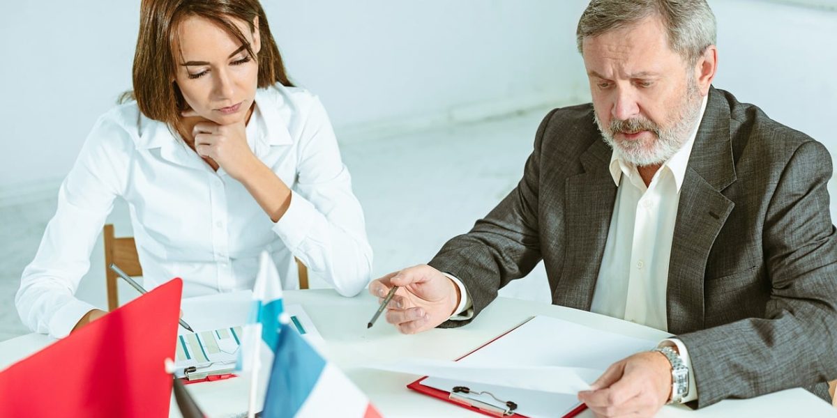 A commercial property agent providing expert guidance to a client during a one-on-one consultation about real estate investment.