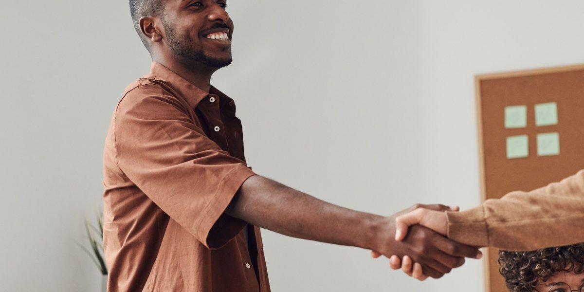 The moment of agreement and trust being established between two business professionals after a thorough vetting process.